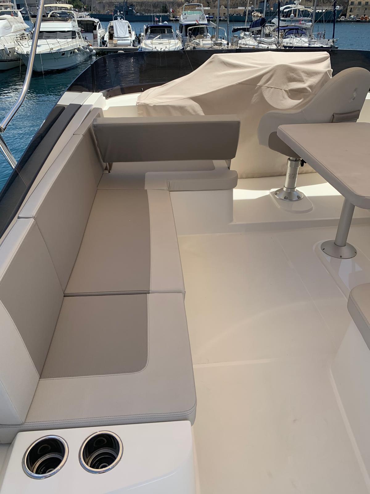 Aft deck with cream-upholstered seating on Bandama's Beneteau Swift Trawler 47