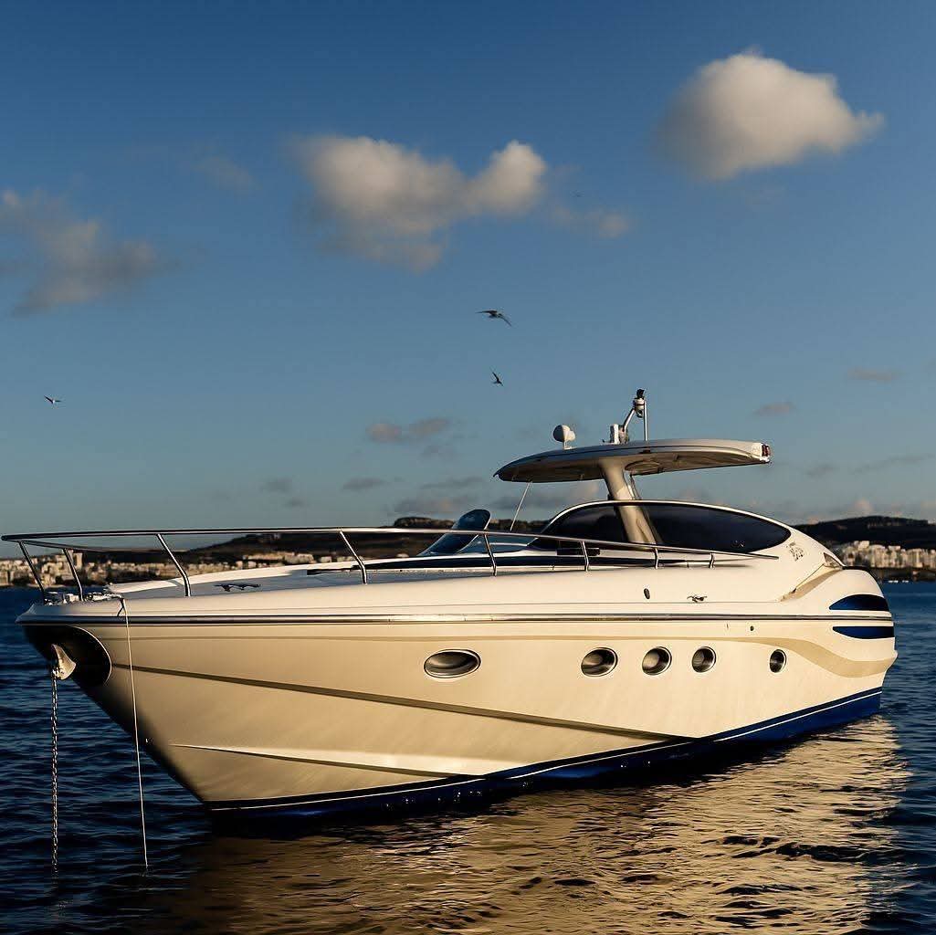 Unexpected — private charter yacht at golden hour off Comino, Malta